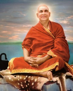 Swami Sivananda sitting by the mighty Ganga - not the Thames.
